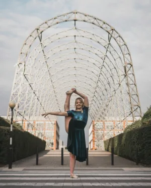 Ballerina In Front Of A Unique Structure