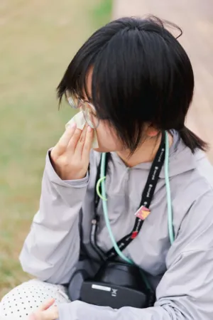 Young Person Wiping Face
