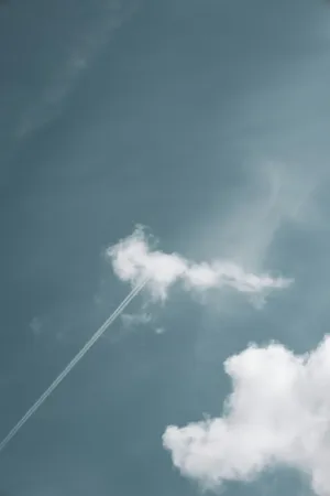 Sky With Clouds And Contrail