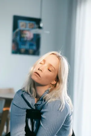 Blond Woman In Blue Top