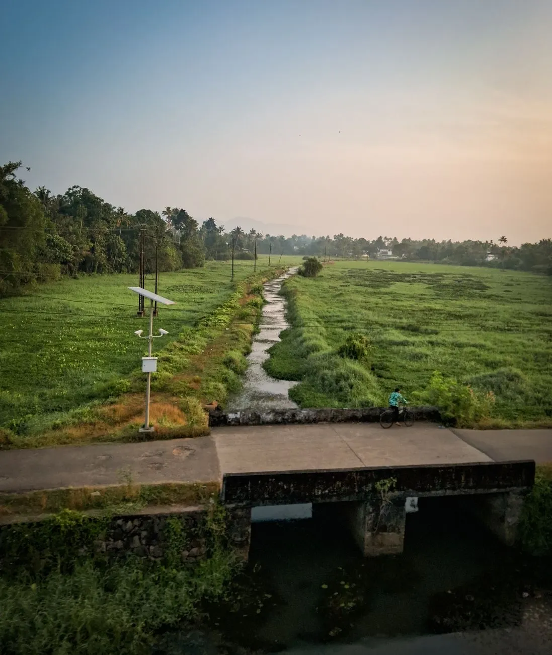 Rural Landscape With Bridge And Stream