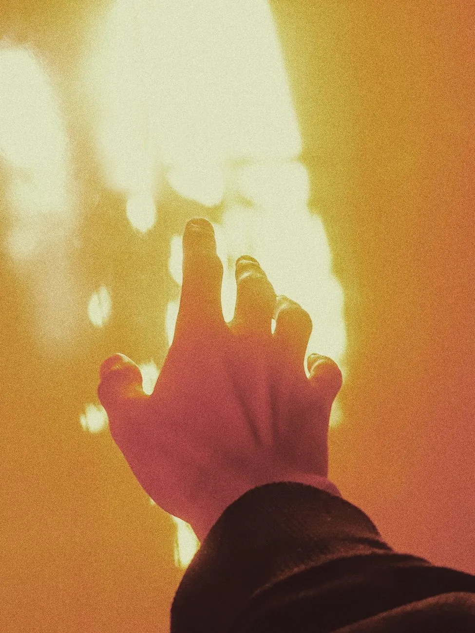 Hand Reaching For Light