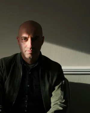 Bald Man In Dark Clothing