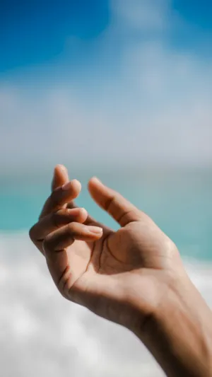 Hand Reaching Out To The Sky