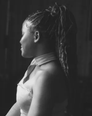 Side Profile Of A Woman With Braided Hair