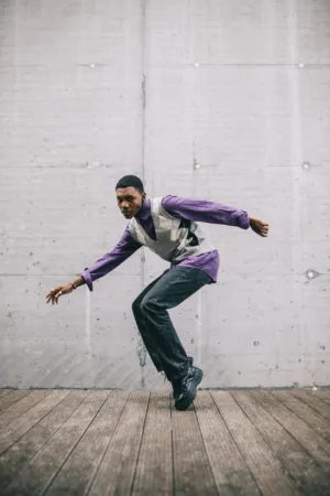 Dancer In Purple Shirt And Gray Vest