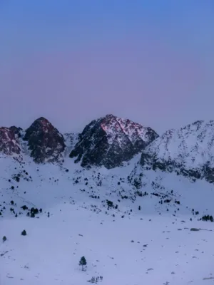 Snowy Mountain Peaks At Dusk