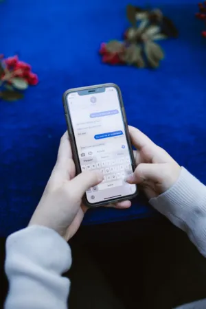 Person Texting On A Smartphone