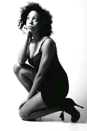 Crouching Woman In Black Dress