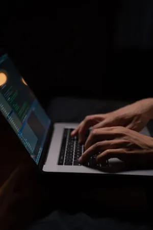 Person Typing On Laptop