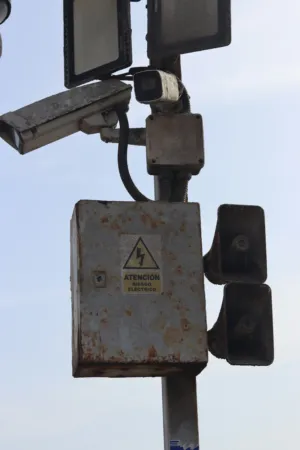 Rusty Electrical Box With Warning Sign