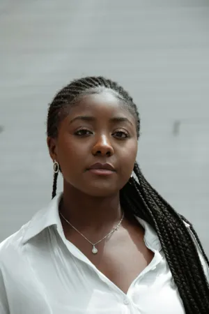 Portrait Of A Woman With Braids