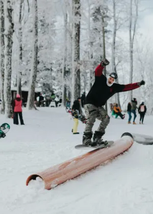 Snowboarding On A Log