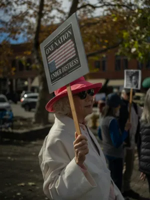 Protestor With 'One Nation Under Distress' Sign