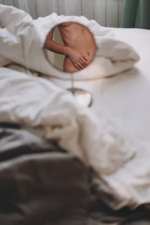 Reflection Of A Person In Bed