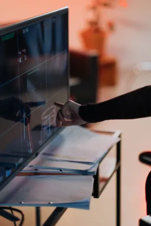Hand Pointing At Monitor