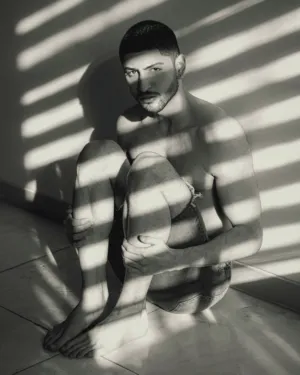 Sitting Man With Light And Shadow