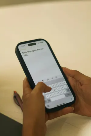 Person Typing On Smartphone