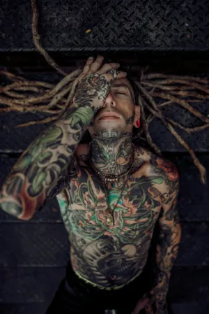 Tattooed Man With Dreadlocks