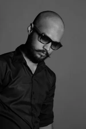 Bald Man In Black Shirt