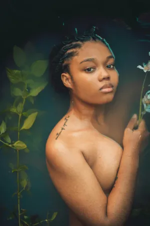 Nude Woman In Water With Plants