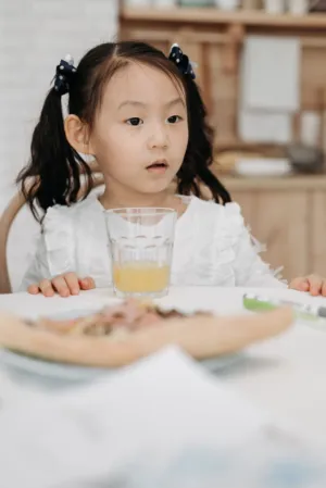 Little Girl At Breakfast