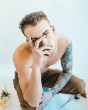 Tattooed Man In Studio