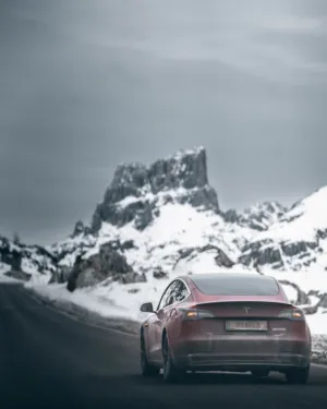 Tesla Model 3 In Snowy Mountains