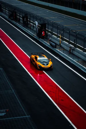 Orange Race Car On Track