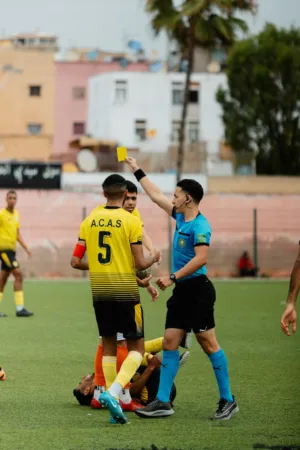 Soccer Referee Showing Yellow Card