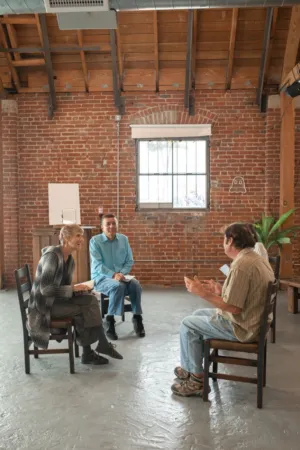 Group Discussion In A Rustic Room