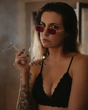 Tattooed Woman With Sunglasses