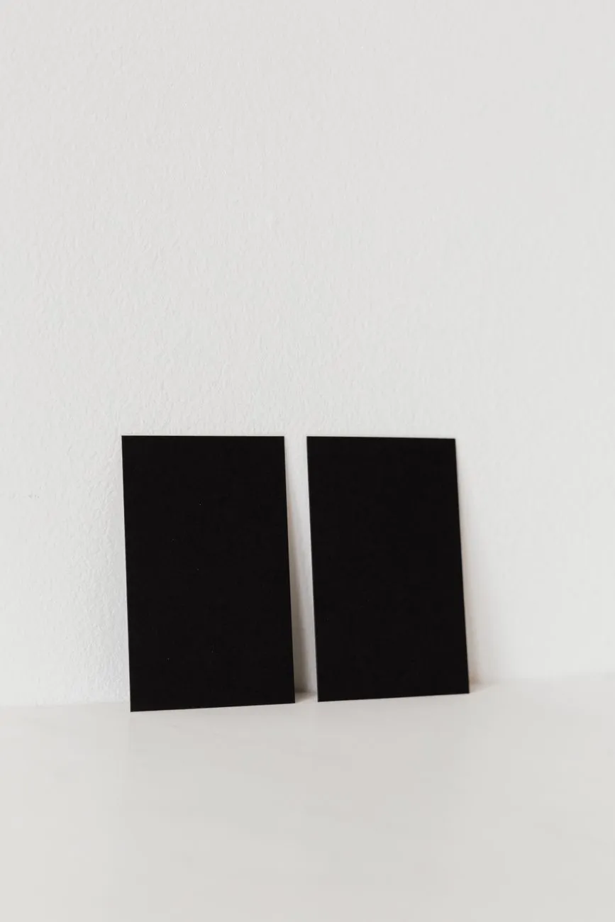 Black Cards On White Surface