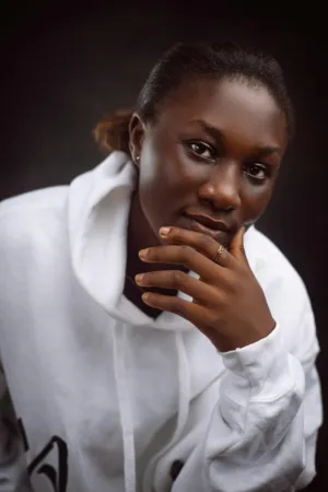 Portrait Of A Woman In A White Hoodie
