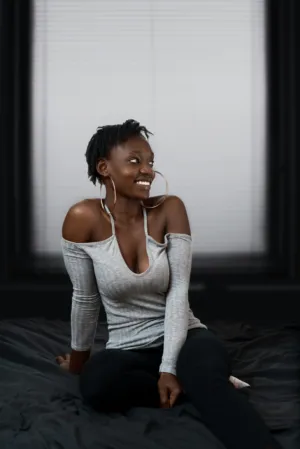 Smiling Woman In Gray Top