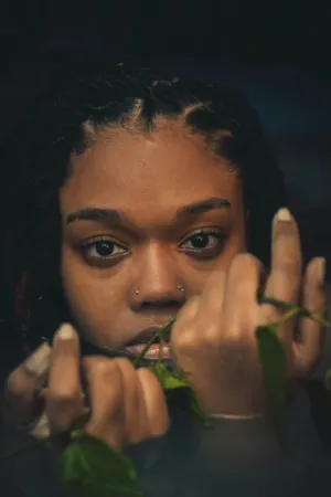 Portrait Of A Woman With Braids