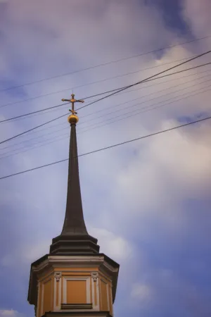 Church Steeple With Cross And Power Lines