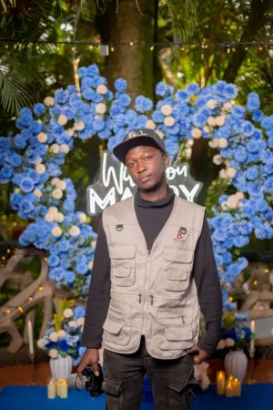 Man In Front Of Floral Arch