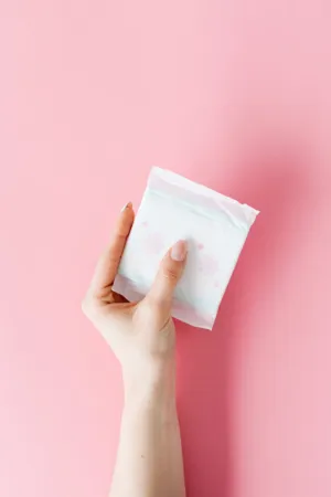 Hand Holding Sanitary Pad