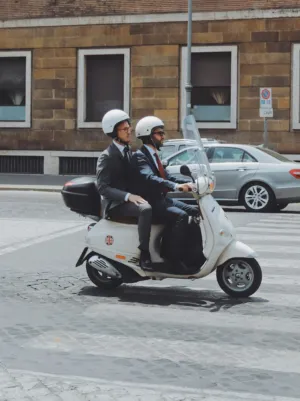 Two Men On A Scooter