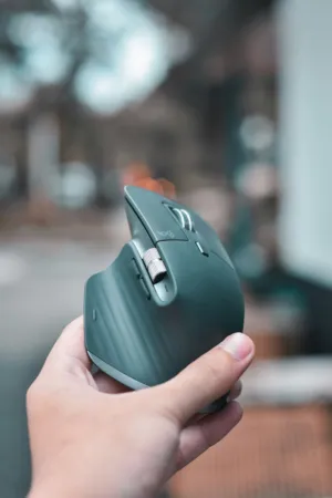 Hand Holding A Modern Wireless Mouse