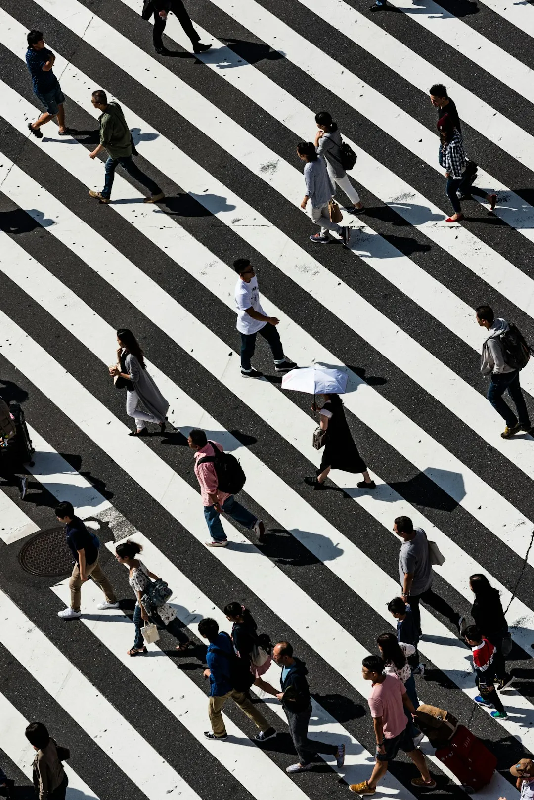 Crowd Crossing A Striped Street