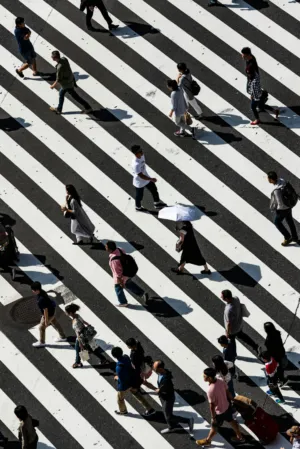 Crowd Crossing A Striped Street