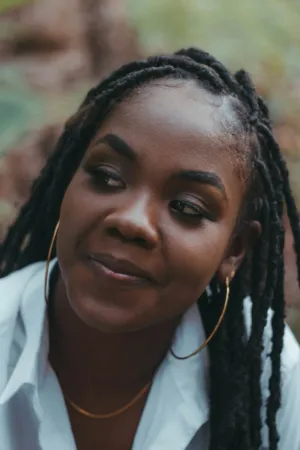 Portrait Of A Woman With Braids