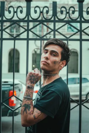 Tattooed Man In Urban Setting