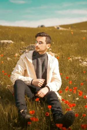 Man In A Field Of Flowers