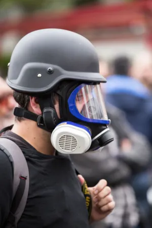 Protestor With Gas Mask And Helmet