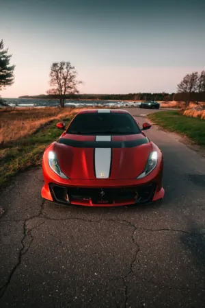 Red Ferrari On Coastal Road