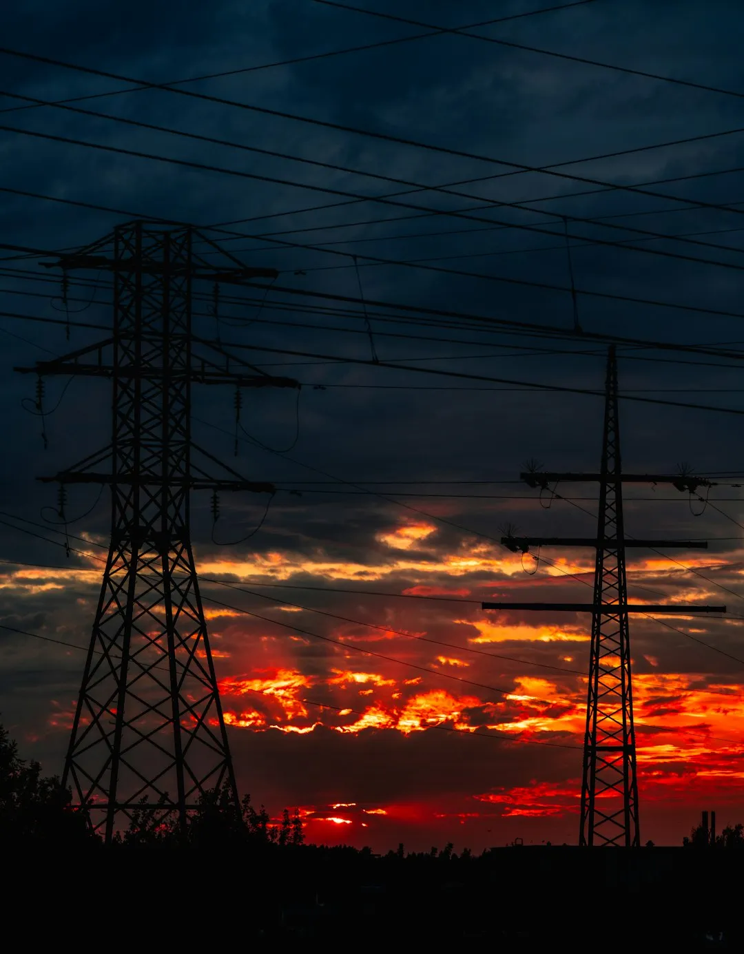 Electricity Pylons At Sunset