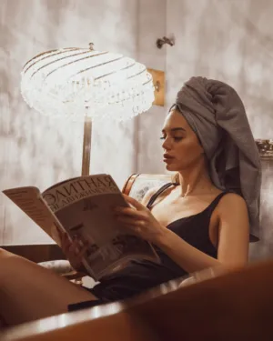 Reading Magazine In A Luxurious Bathroom